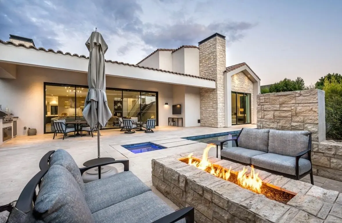 Twilight outdoor living: fire pit, pool, and spa